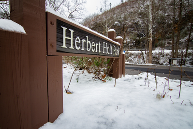 Herbert Holt Park sign in the snow
