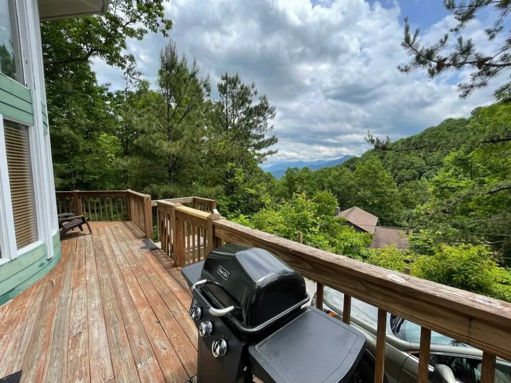 Large Black Grill on a Wood Deck