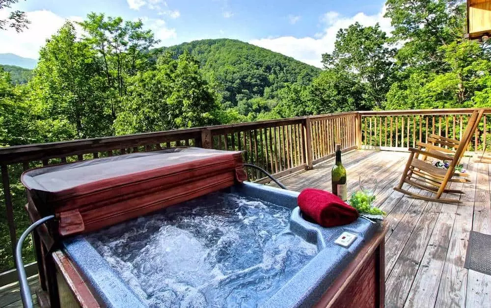 hot tub on deck of cabin in gatlinburg