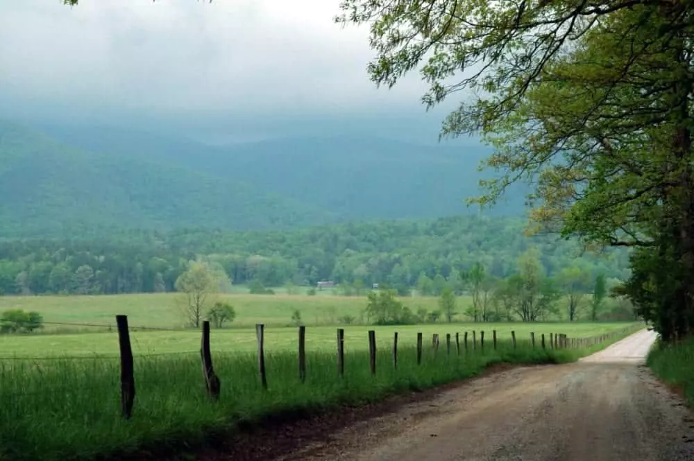 cades cove loop with fog over the mountains