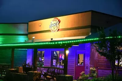 outside of three jimmy's good time eatery at night