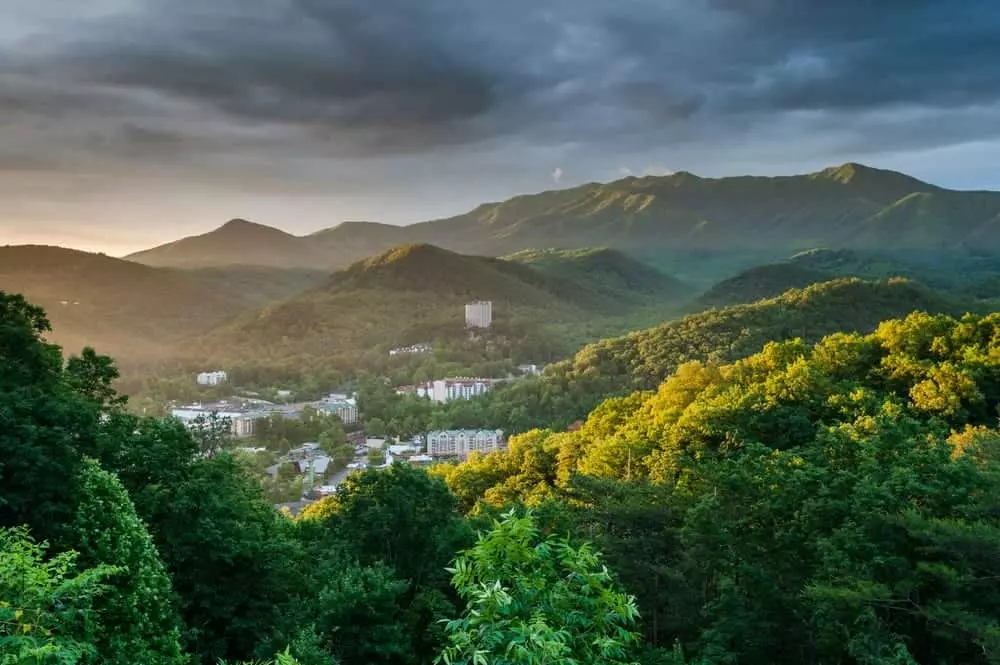 gatlinburg in the distance with a sunrise coming up over the mountains