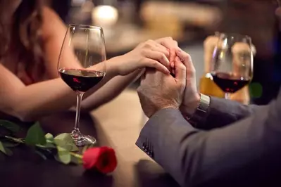 Couple with wine and roses