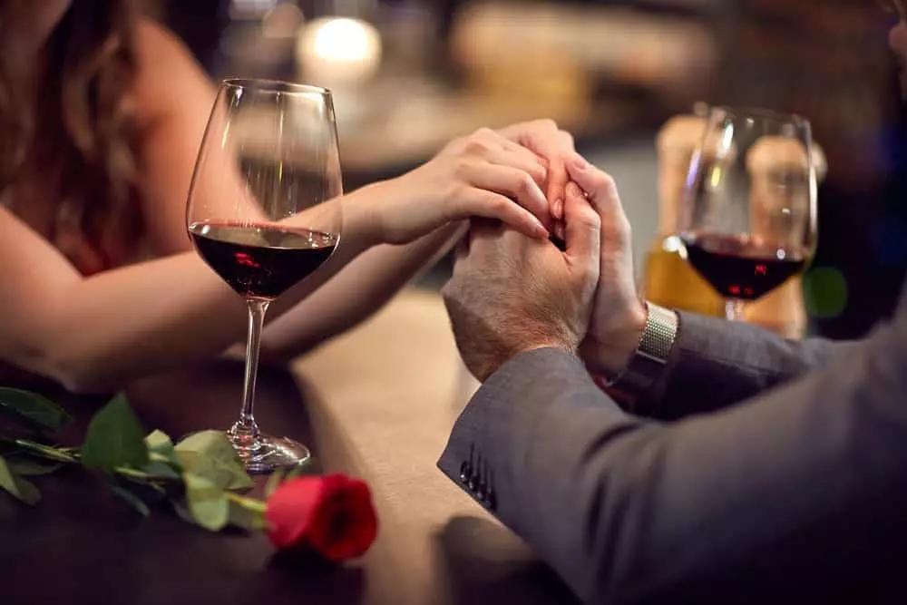 Couple with wine and roses