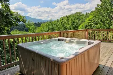 Hot tub on the deck of the Perfect Pointe of View cabin.