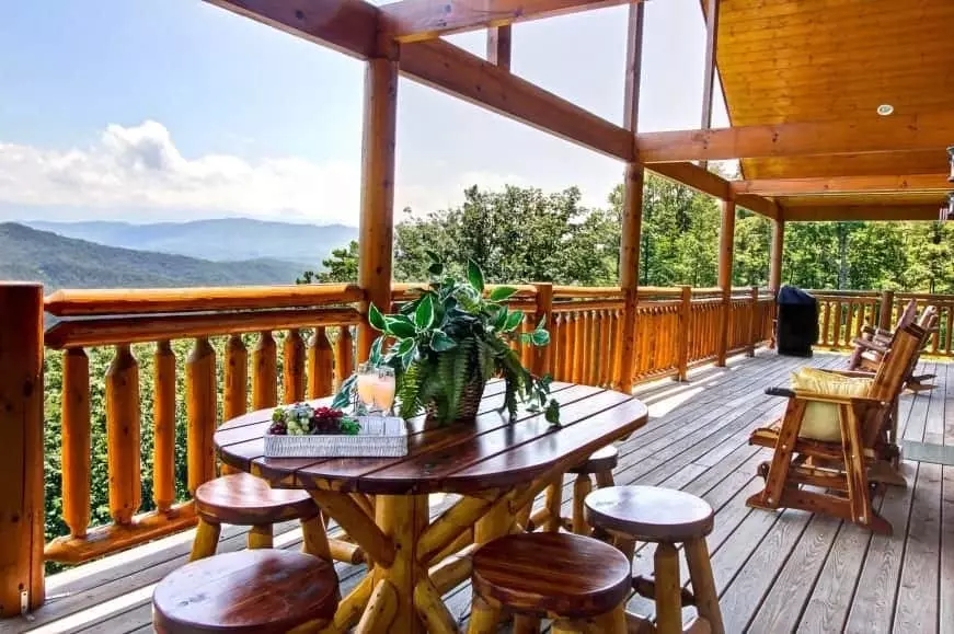 A table and chairs on the deck of the Majestic Escape vacation rental in Gatlinburg.