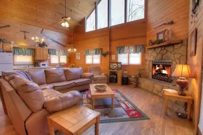 Living room with fireplace at the Arrowhead cabin in Gatlinburg.