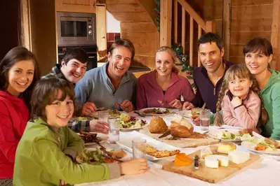 Relatives enjoy a tasty meal in their cabin.