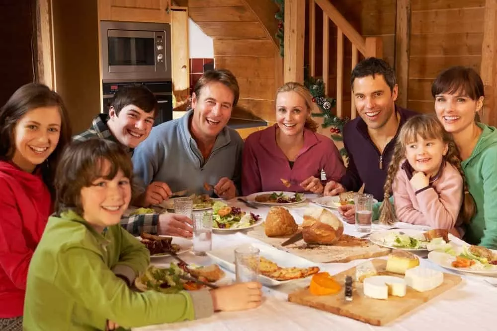 Relatives enjoy a tasty meal in their cabin.