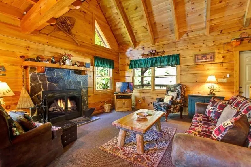 Delightful living room with fireplace in one of our Sevier County cabin rentals.