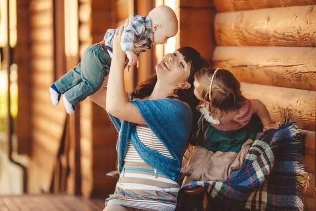 happy family in front of a one bedroom cabin in Gatlinburg