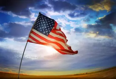 American Flag in front of blue sky