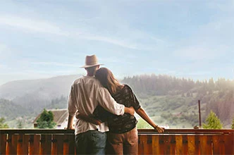couple on deck of Smoky Mountain cabin