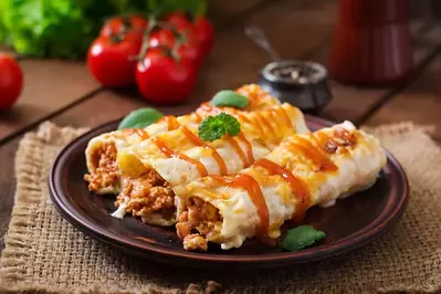 enchiladas covered in sauce