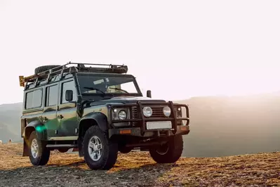 green jeep on a mountain