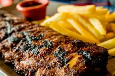 dry rub ribs on plate with fries