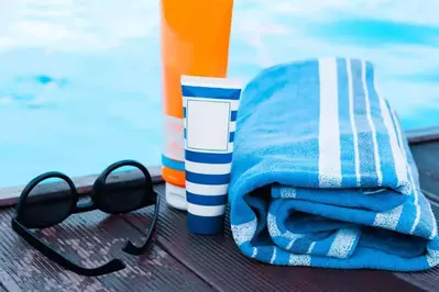 pool towel and sunscreen