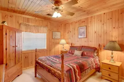 bedroom in one of the 3 bedroom cabins in sevierville