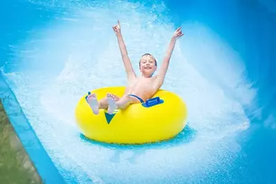 boy-on-slide-at-water-park