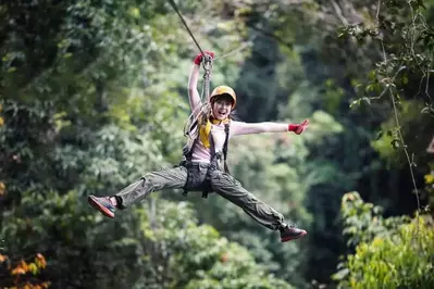 girl smiling while zip lining