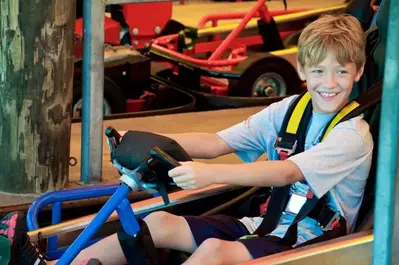 Young boy smiling on go kart at The Track in Pigeon Forge TN