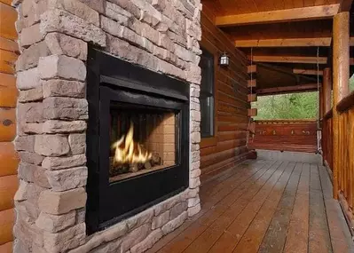 The outdoor fireplace at the River Romance cabin in Pigeon Forge.