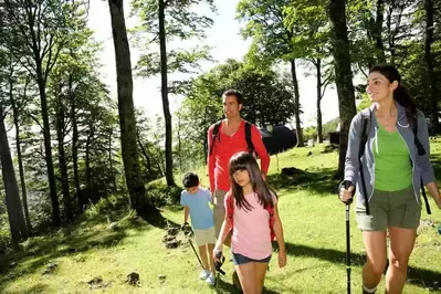 Family hiking together in the mountains.