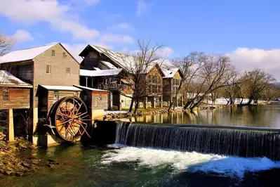 The Old Mill in Pigeon Forge covered in snow.