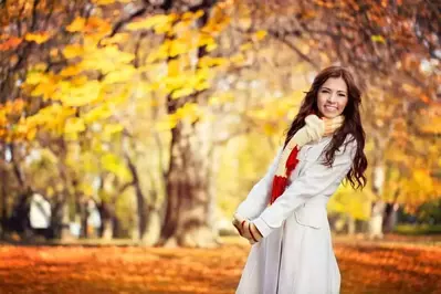 Woman dressed in fall clothing.