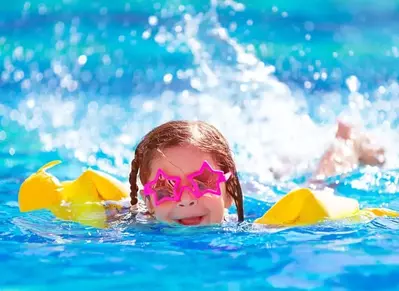 girl swimming in a pool in Pigeon Forge