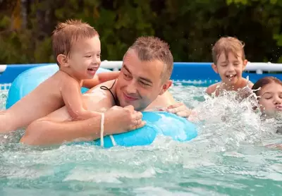 family swimming at cabins in Pigeon Forge TN with pools