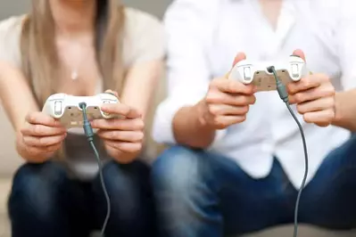 Couple playing video games in a Gatlinburg cabins