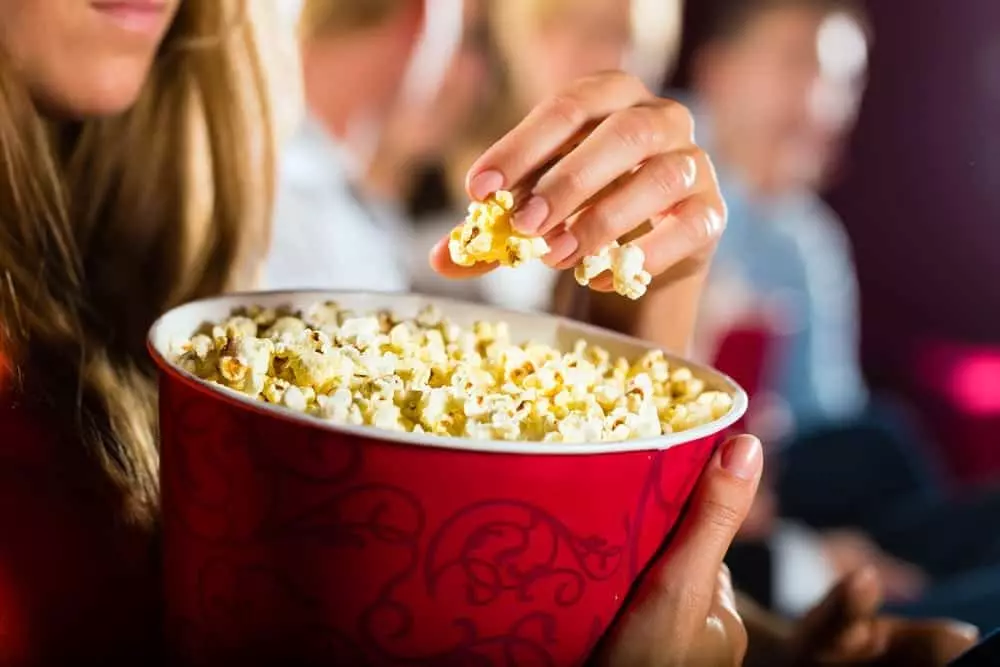 eating popcorn and watching a movie in a Gatlinburg cabin with home theater