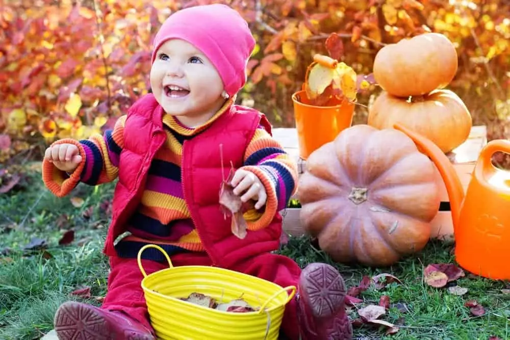 little girl with pumpkin at Halloween event at The Island in Pigeon Forge