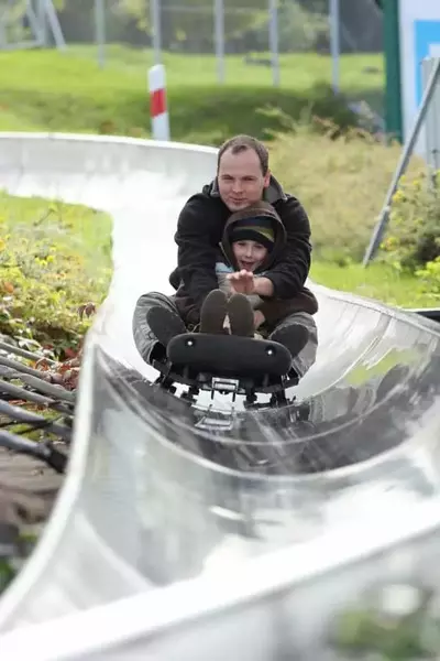 father and son on roller coaster in Pigeon Forge