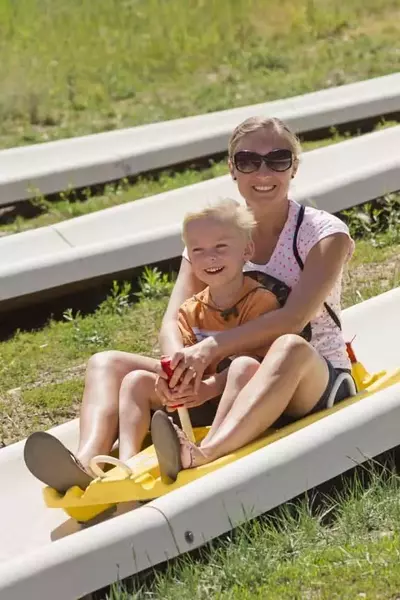 mother and son on Smoky Mountain Alpine Coaster attraction in Pigeon Forge
