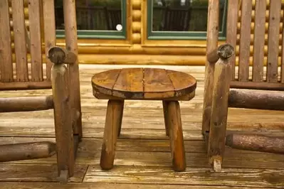 two rocking chairs on a cabin rental's back porch