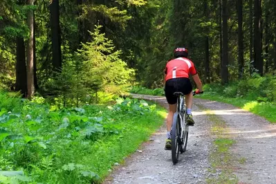 Girl during cycling trip on the mountains